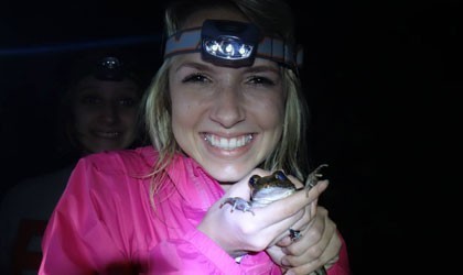 Vet intern holding a frog