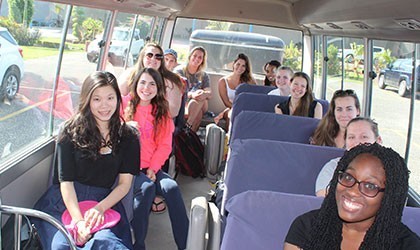 Vet interns riding a shuttle bus