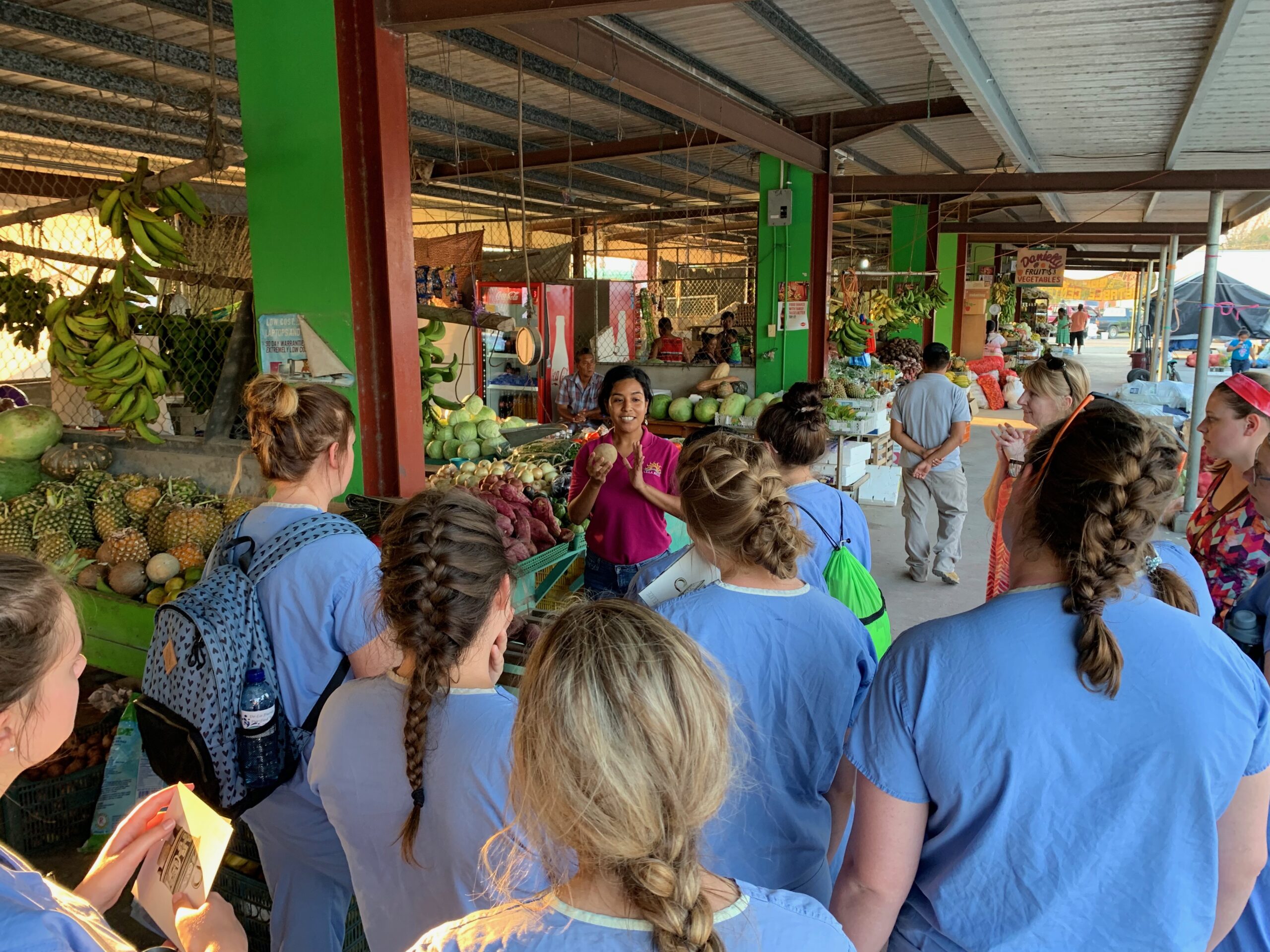 Group of nursing students in an outdoor market