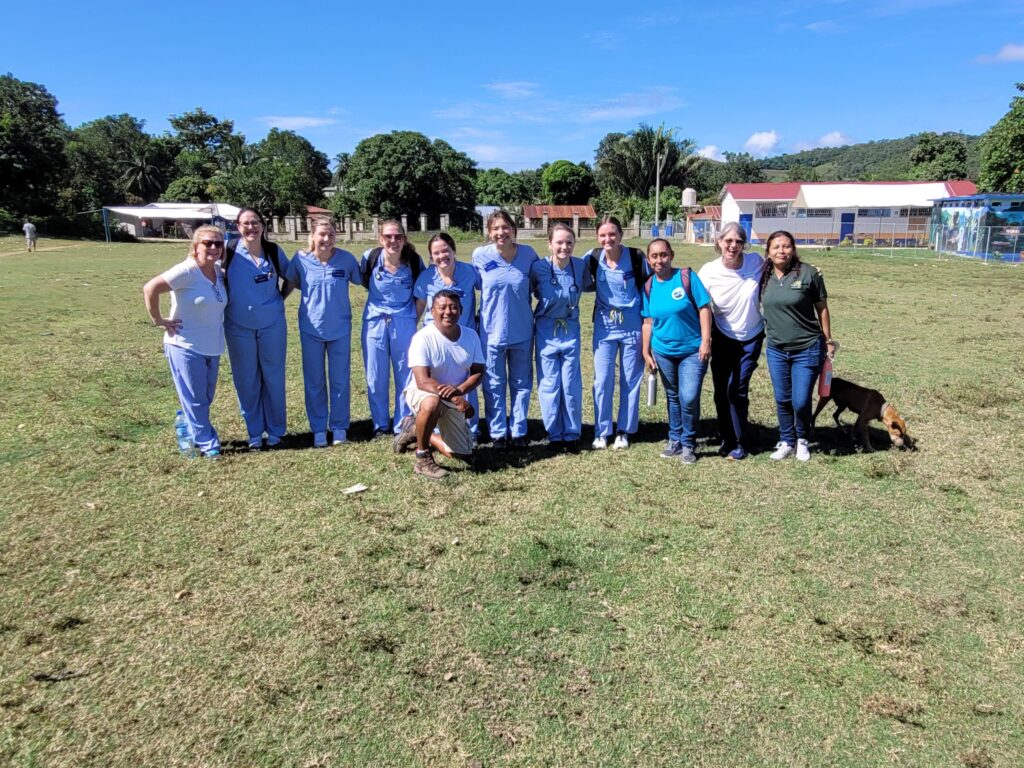 Group of nursing study abroad nursing students in a field